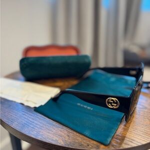 Gucci Black Sunglasses with Gold Emblem